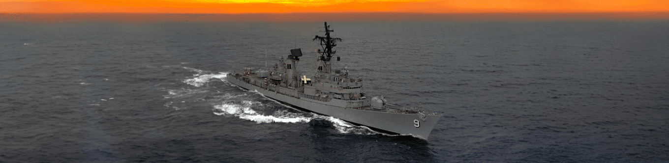 USS Towers underway at sunset